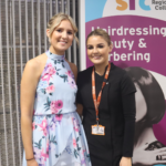 Hairdress Event SSP student in flowerly dress hairdressing student on right