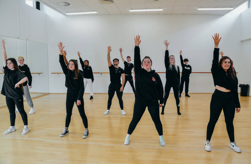 Group of SRC participating in dance class in campus dance studio
