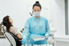 Dental student with patient in chair