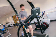 Male SRC student using treadmill in sports science lab