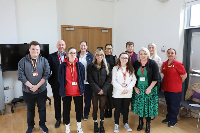 Picture comprised of students and health care professionals.