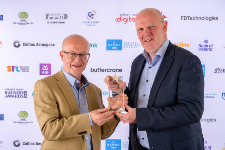 Brian accepting award
